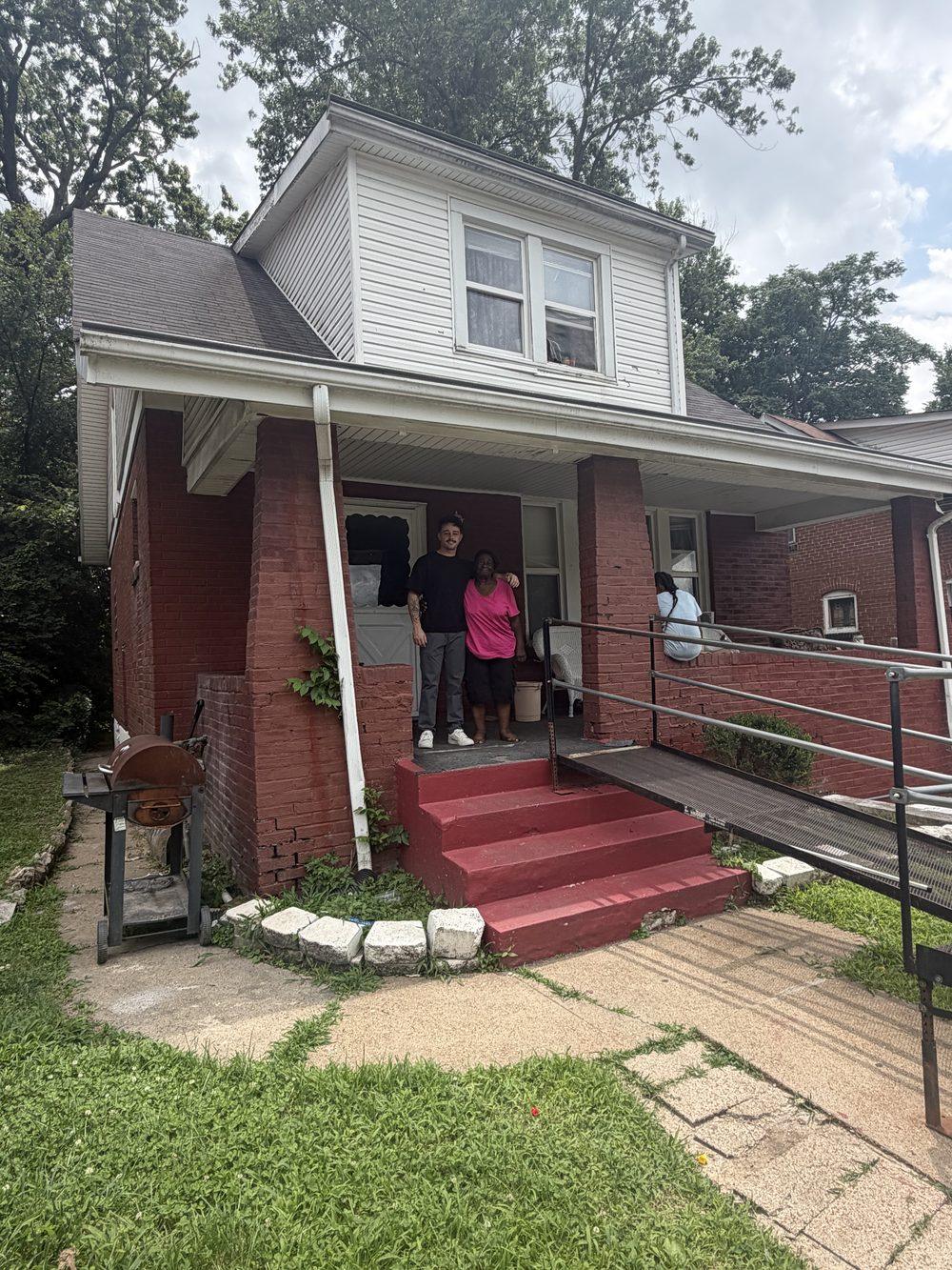 Sam of Brickyard Home Buyers, an Ohio cash home buyer, with a homeowner on her front porch